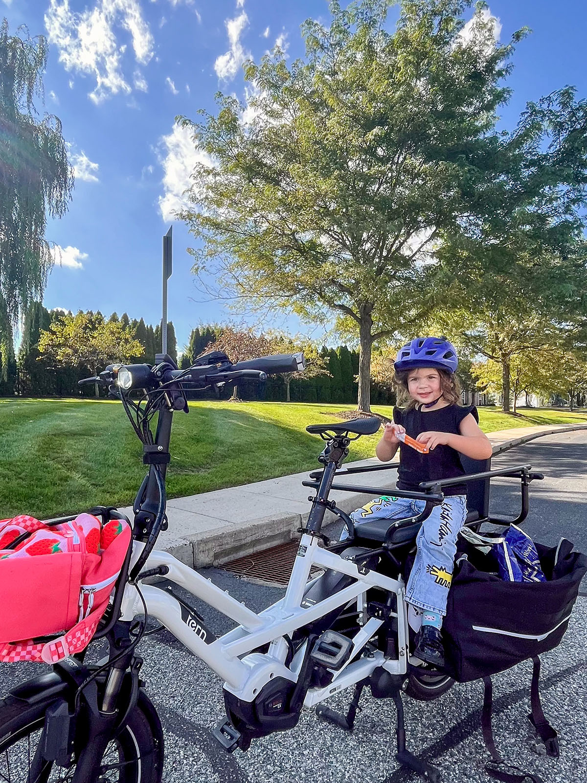 girl riding a tern gsd electric cargo bike